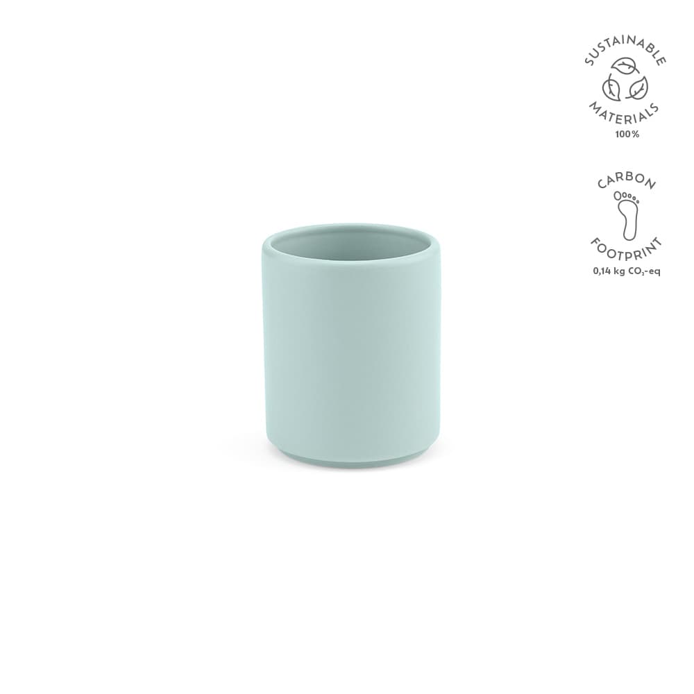 A ceramic mug in a soft mint green matt finish, featuring a logo and sustainable materials indication.