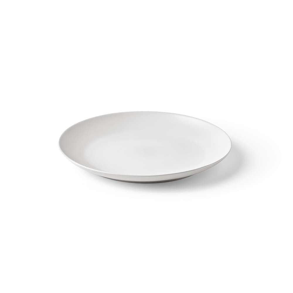 A white ceramic dinner plate with a matte finish, made in Portugal, featuring a sleek, modern design.