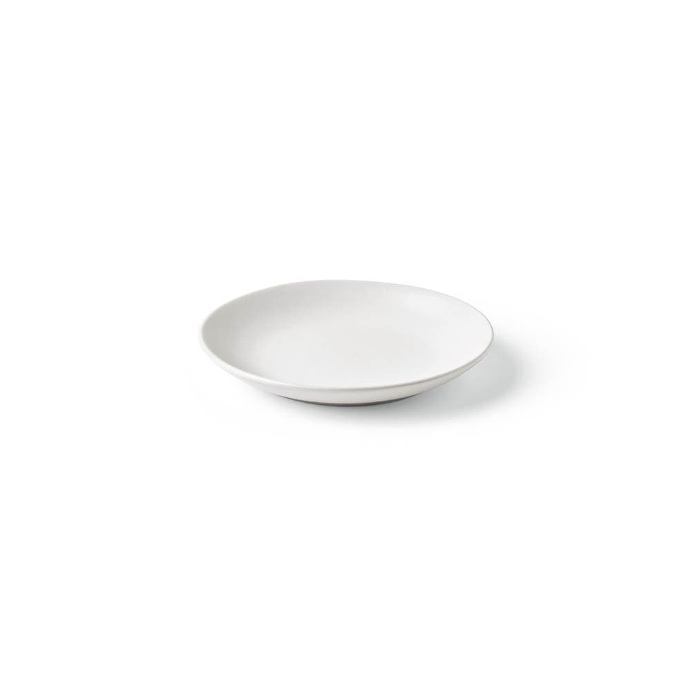 A white ceramic dessert plate with a matte finish. Made in Portugal and features a logo.