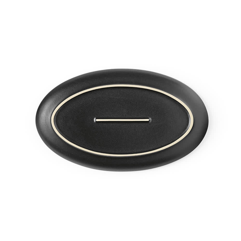A black ceramic platter with a matte finish and a cream-coloured rim. It has a logo on the base.