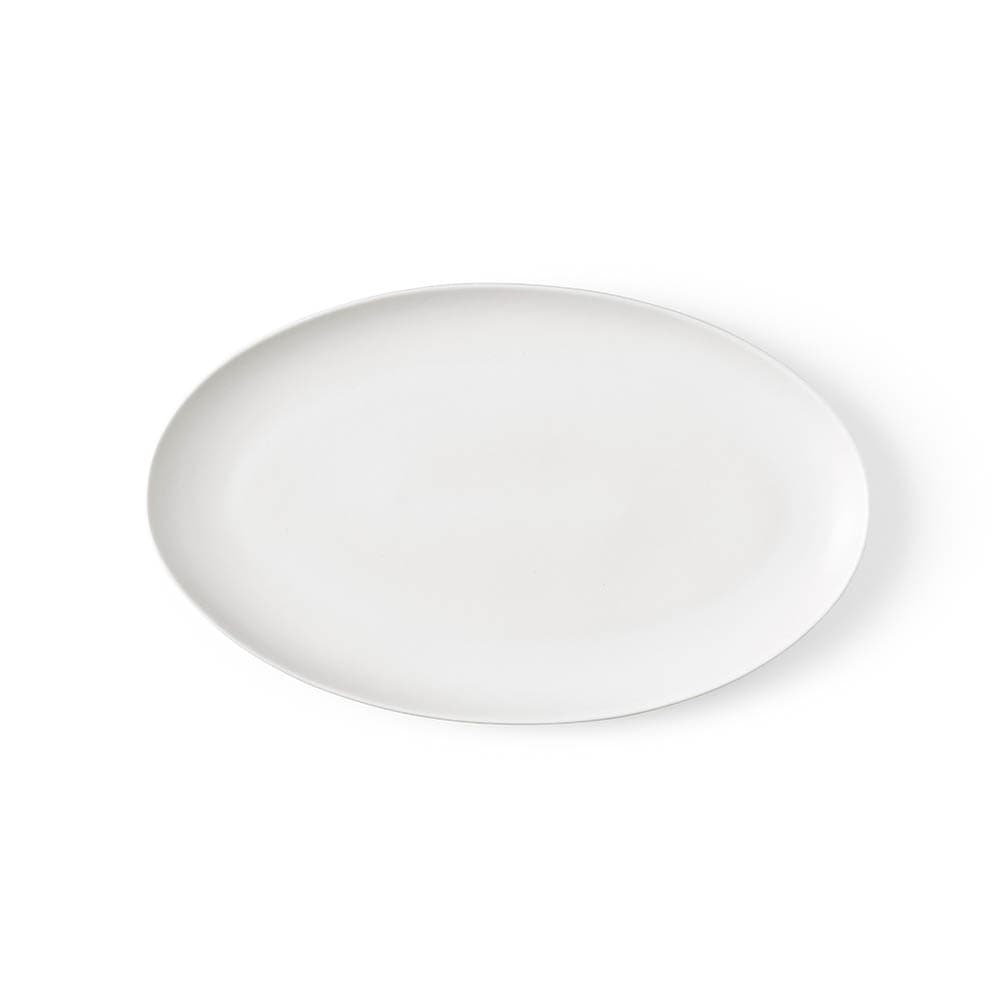 A white ceramic platter with a matt finish, featuring an oval shape, made in Portugal.