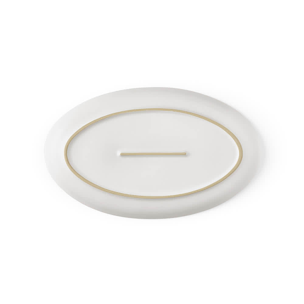 A white ceramic platter with a matte finish and a subtle gold rim. Made in Portugal. Features a logo.