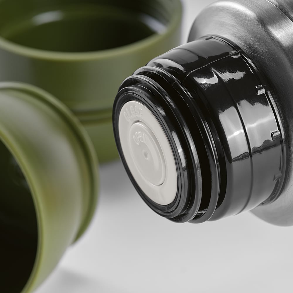A drink bottle with a black lid and olive green cups, accompanied by a carabiner. It features a logo.