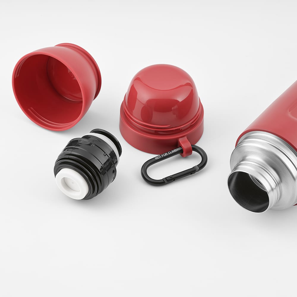 A red thermos with a silver body, two detachable cups, a carabiner, and a black lid component.