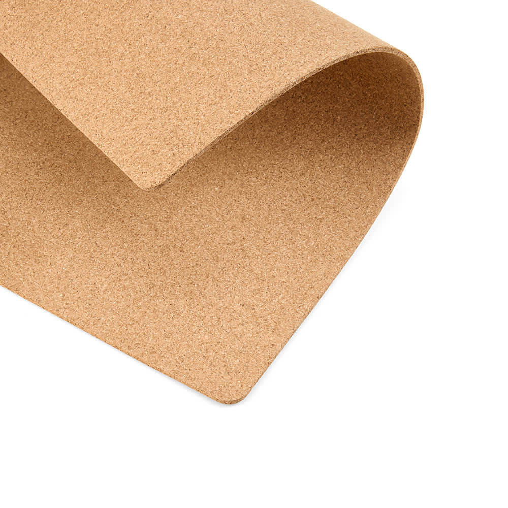 A rectangular cork placemat in a natural tan colour, featuring a smooth, textured surface. Made in Portugal.
