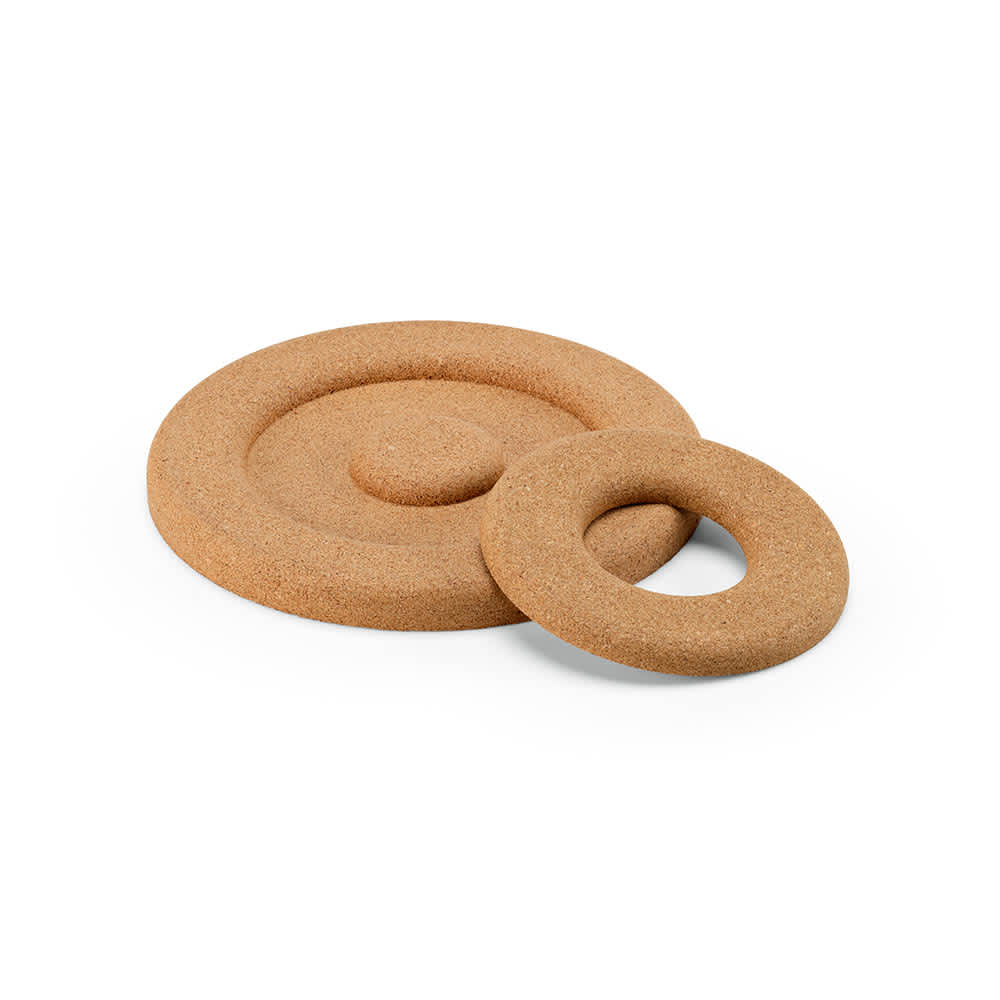 A round cork double trivet in light brown with two circular sections, featuring a design suitable for heat protection.