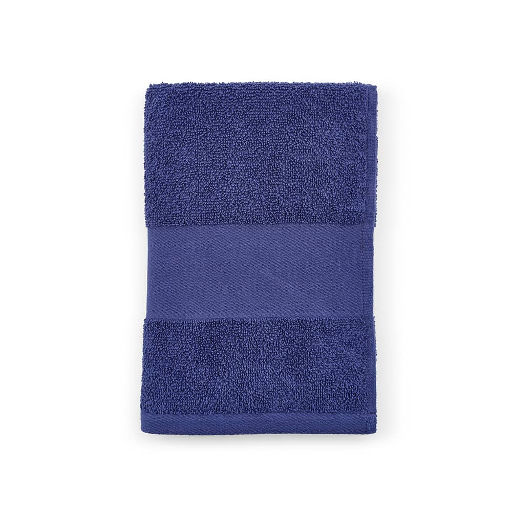 A navy blue towel made of cotton with a textured surface, featuring a smooth band. It has a branding logo.