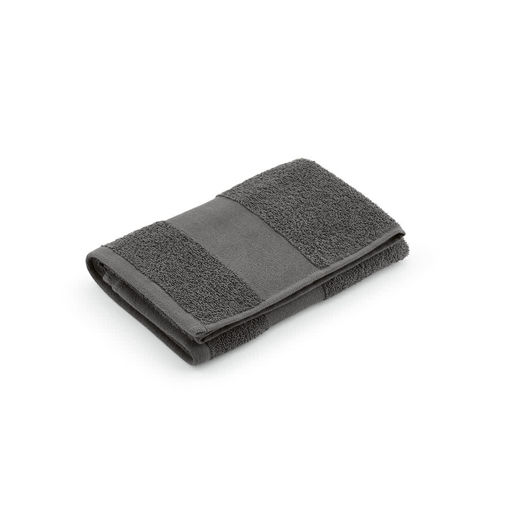 A grey cotton towel featuring textured and smooth sections, neatly folded. It has a logo on one side.