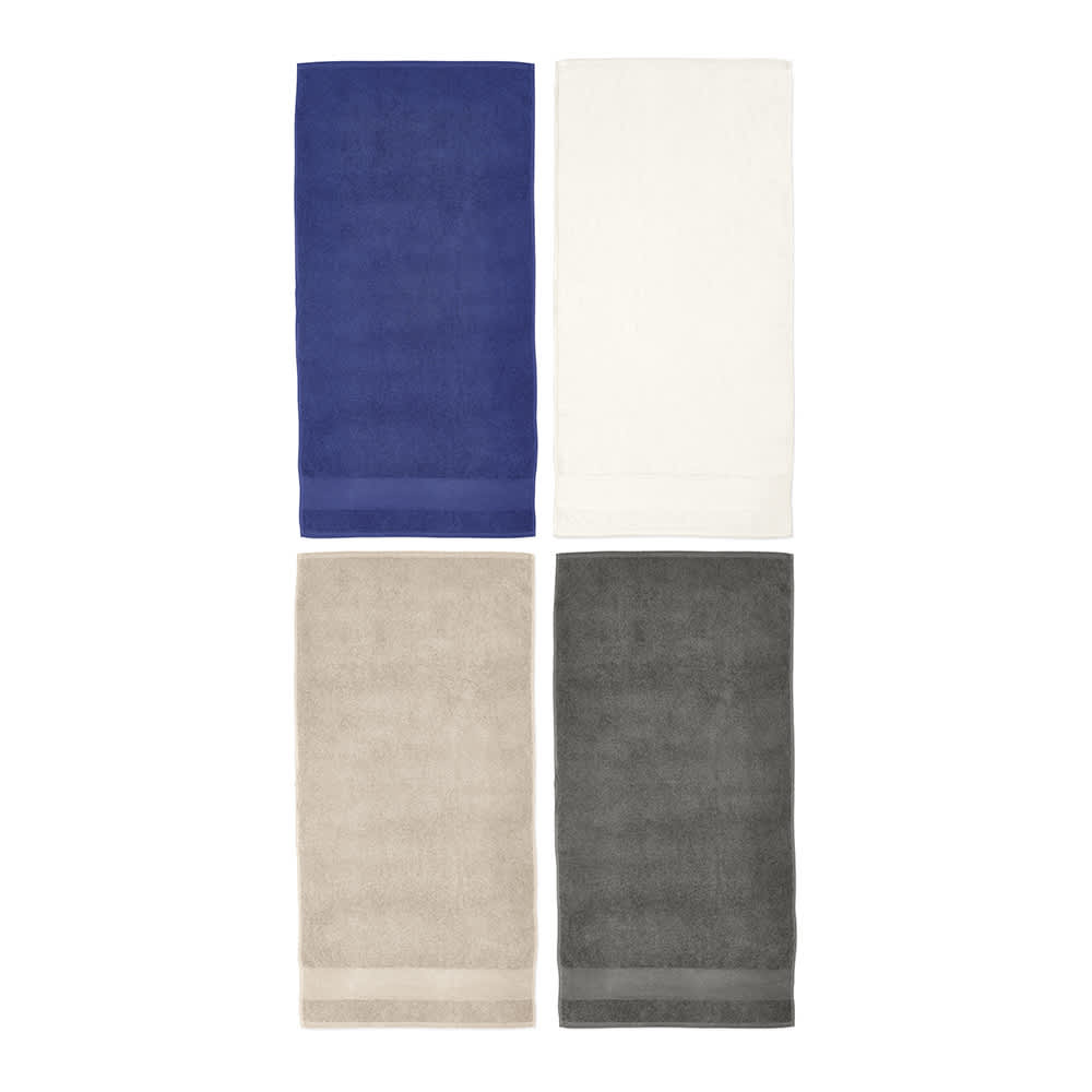 A set of four towels in navy blue, white, beige, and grey, featuring a simple design and a logo.