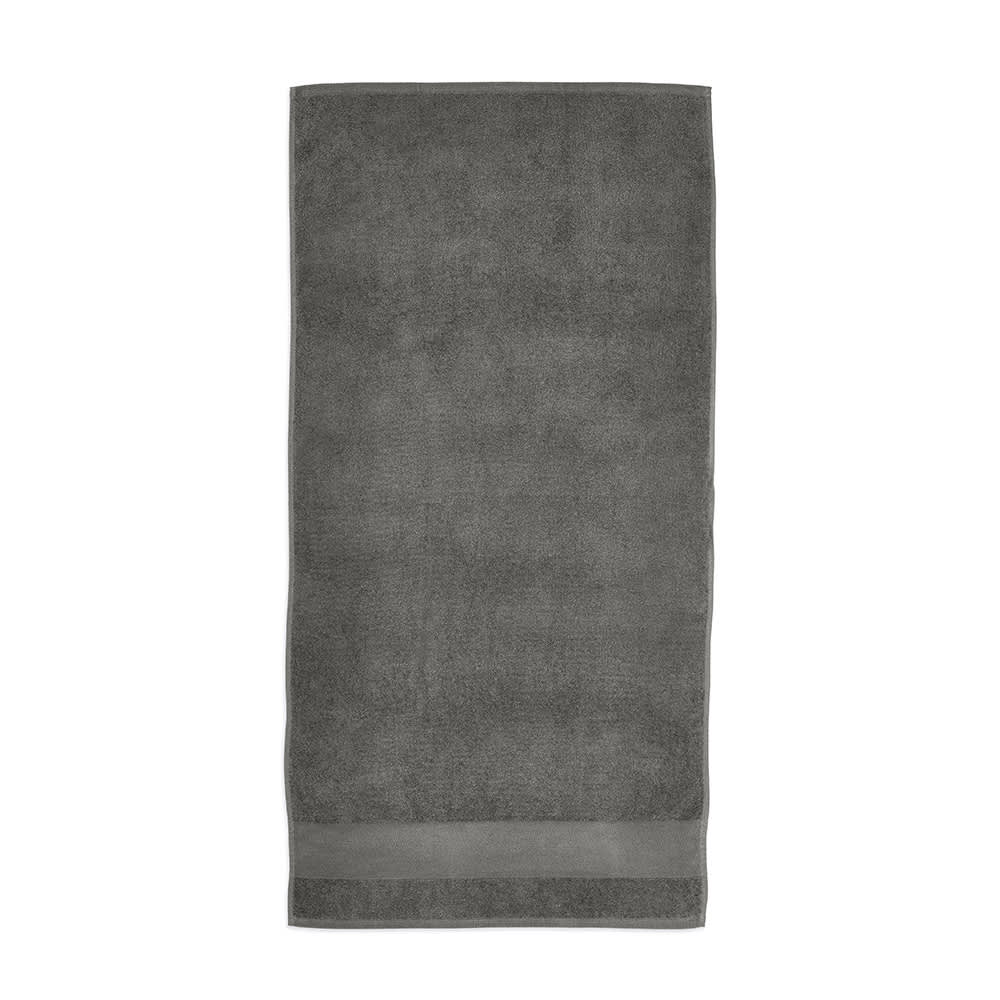 A grey cotton towel with a smooth border, made in Portugal, featuring a logo.