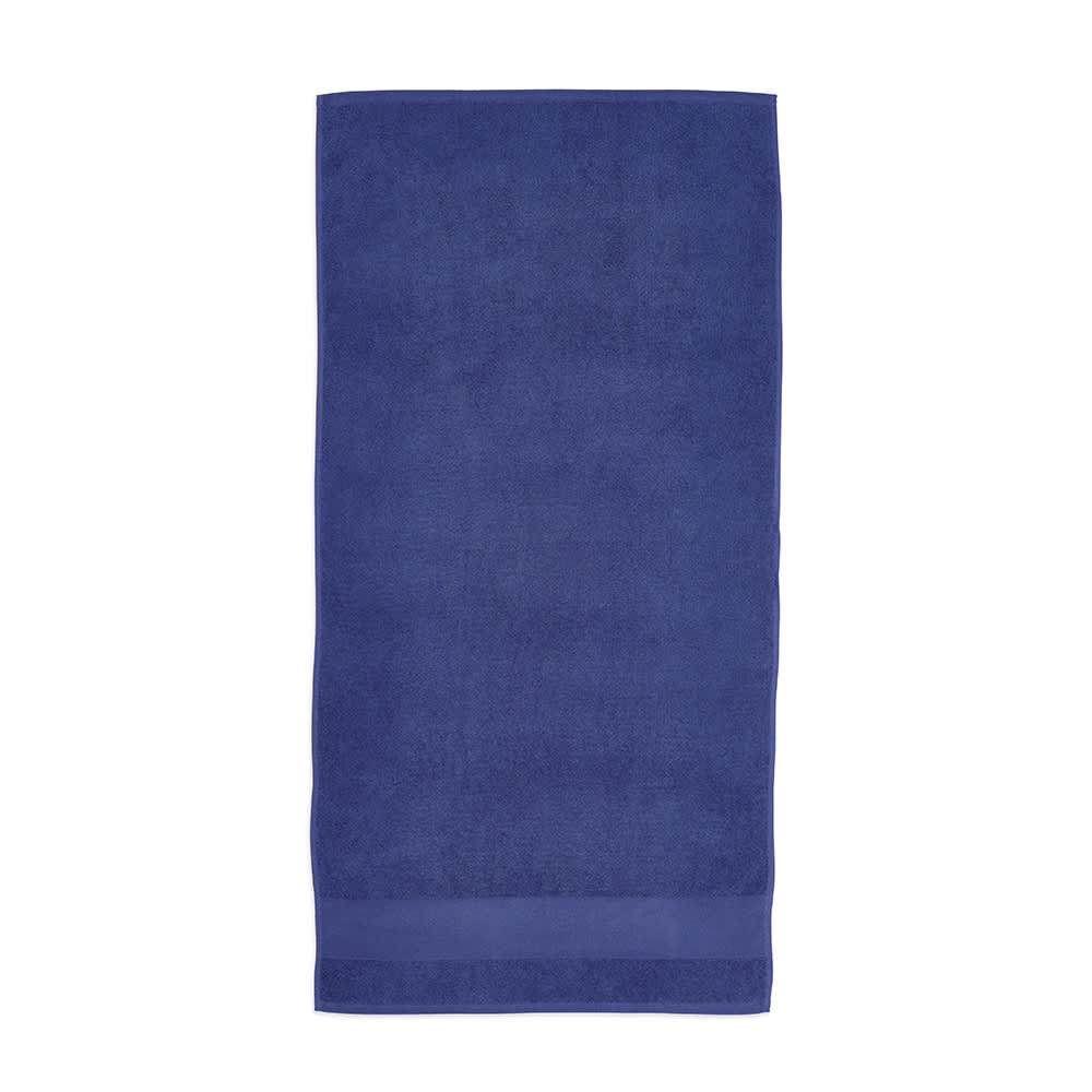 A dark blue cotton towel made in Portugal, featuring a solid design and a subtle branding logo.