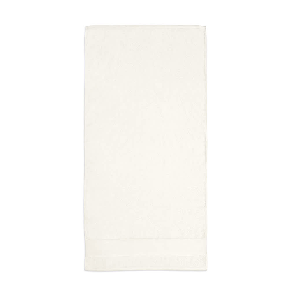 A soft cream towel made of 100% cotton, featuring a simple design and a logo.