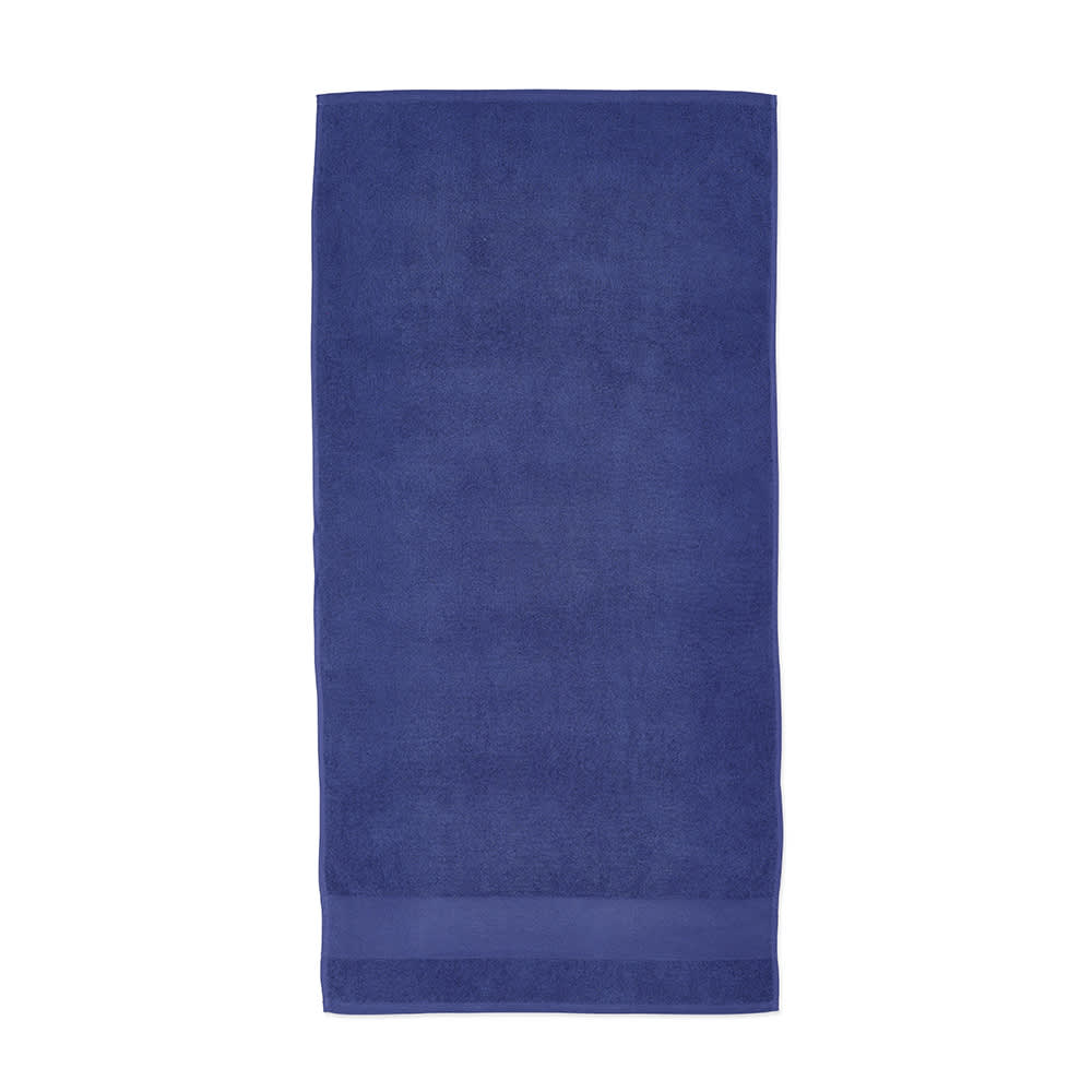 A deep blue cotton towel, featuring a smooth finish and a subtle, stitched band along the edge.