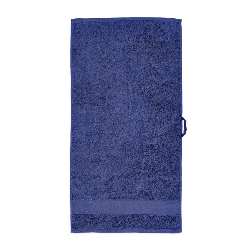 A navy blue towel made of cotton, featuring a textured surface. It has a branding logo.