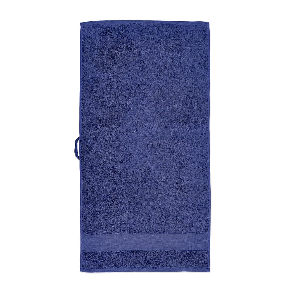 A navy blue towel made from cotton, featuring a textured surface and a hanging loop. It has a branding logo.