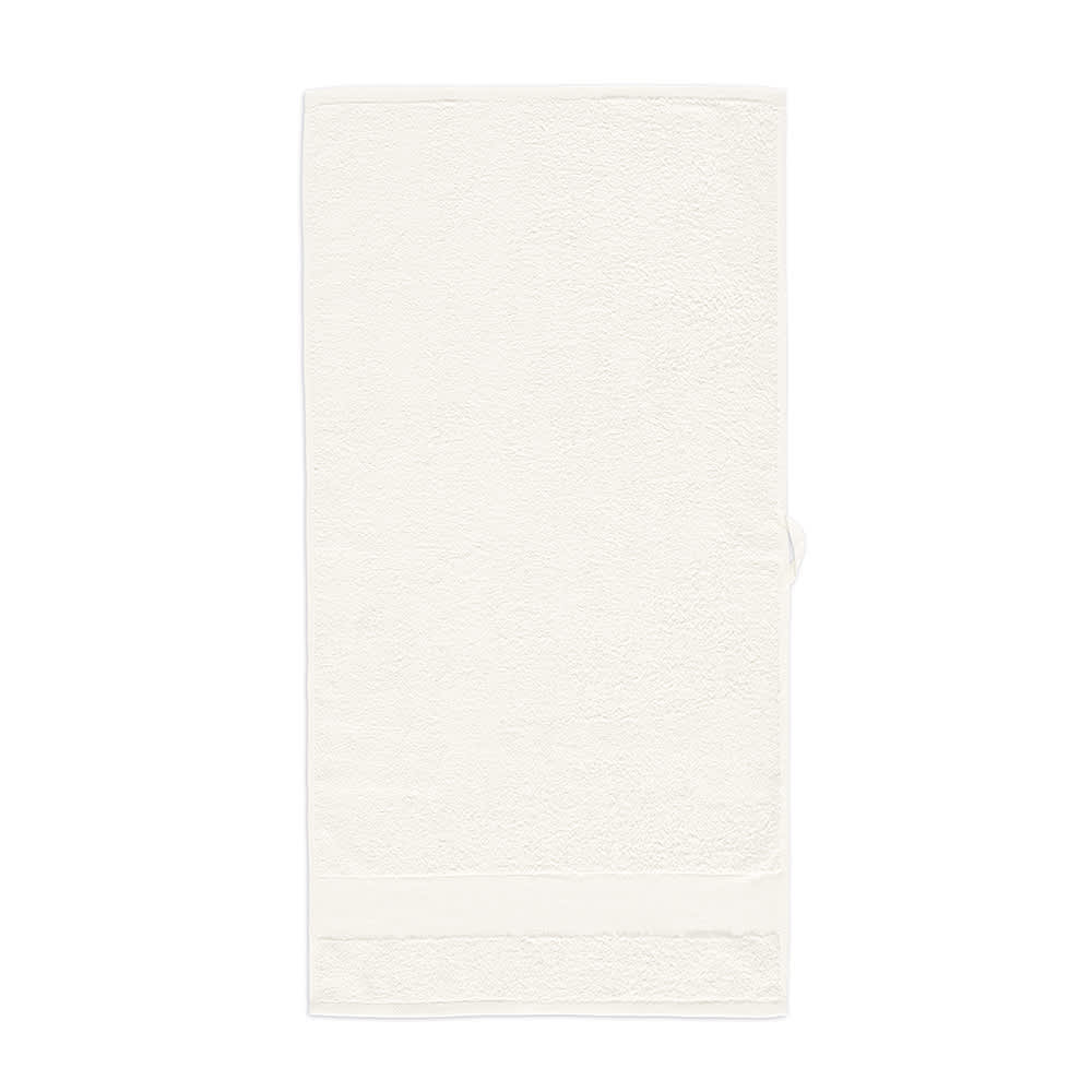 A soft cream-coloured towel made from cotton, featuring a simple design with a logo at the bottom.