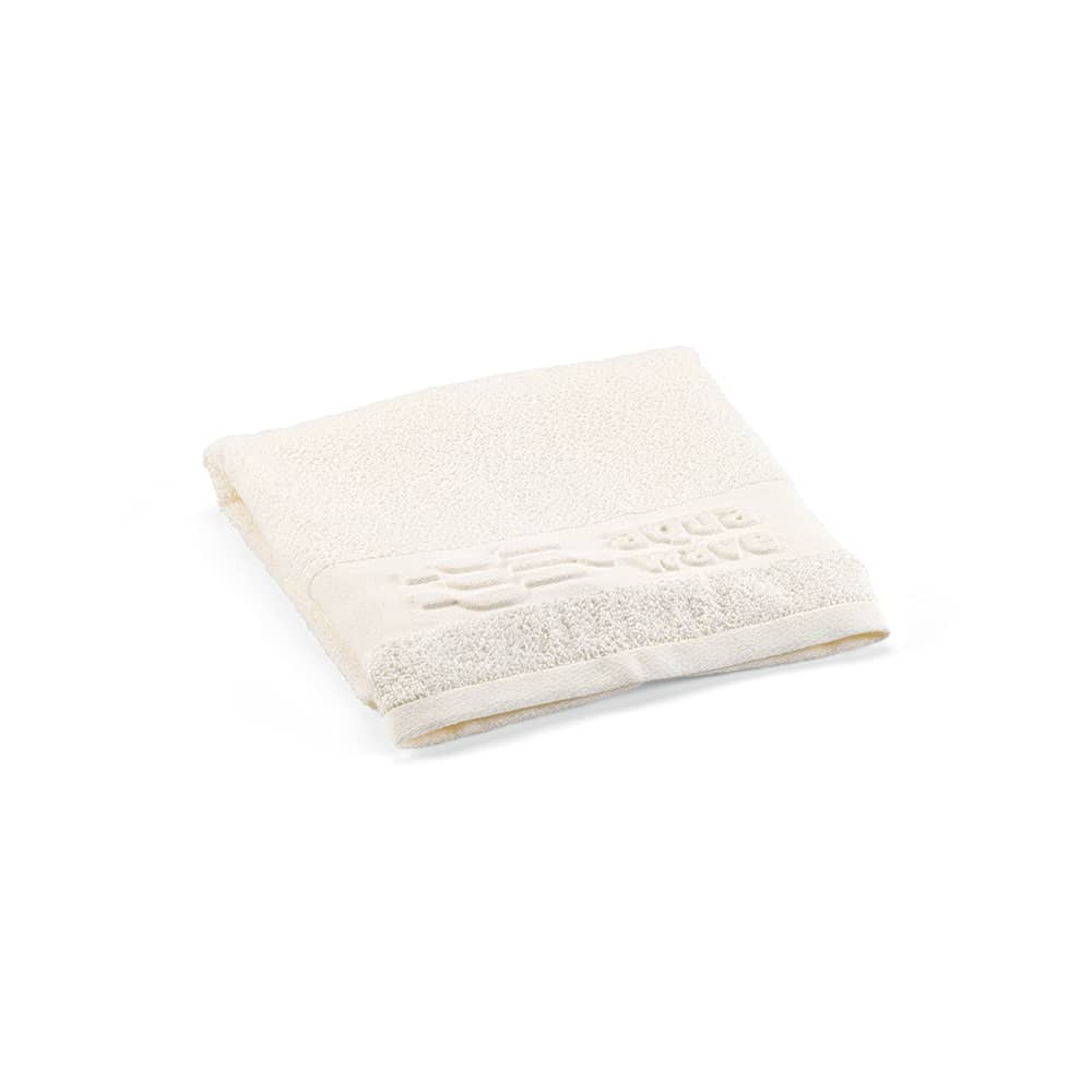 A folded off-white towel with a textured design, featuring a logo on one side. Made from cotton, 370gsm weight.
