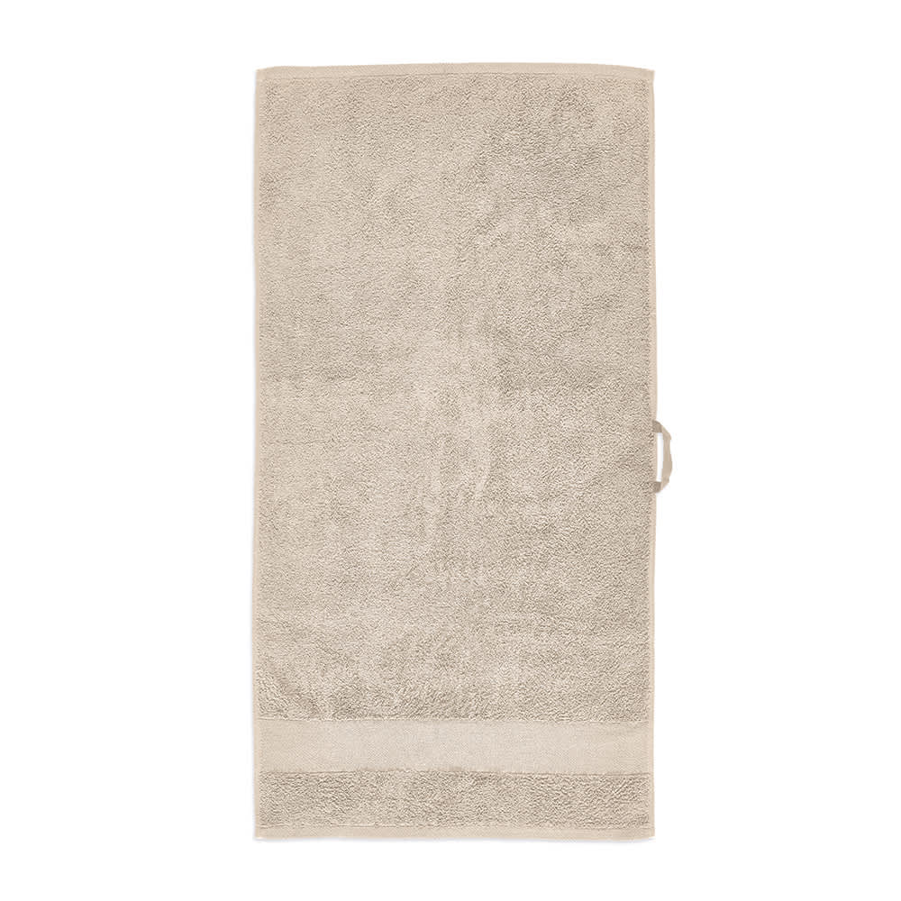 A cream-coloured towel made of 370gsm cotton, featuring a textured surface and a branding logo.