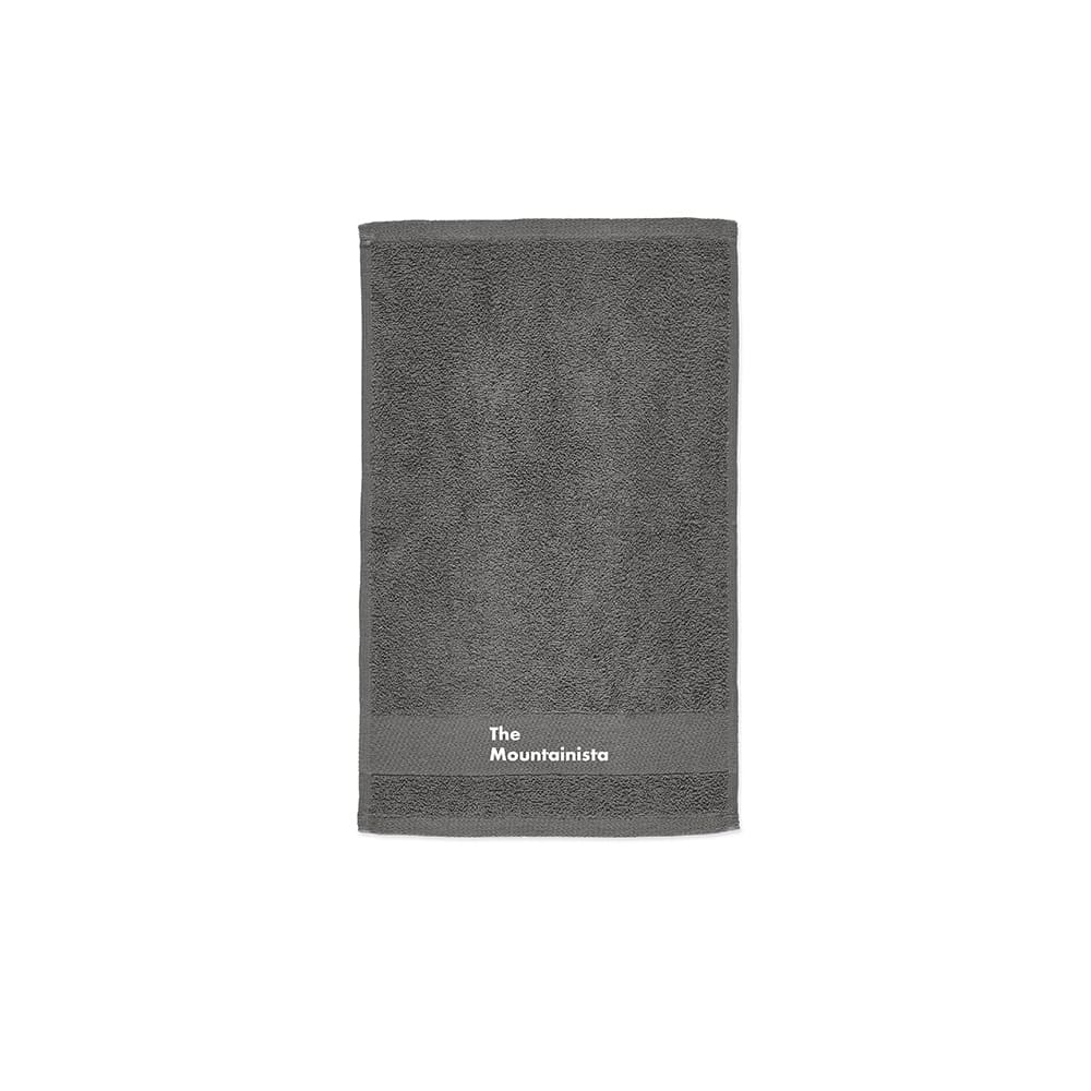 A grey towel with a textured surface and a branding logo at the bottom.