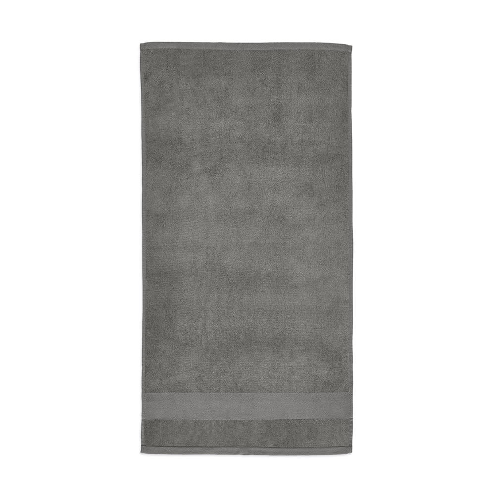 A grey towel made from 500 gsm cotton, featuring a simple design and a subtle logo.