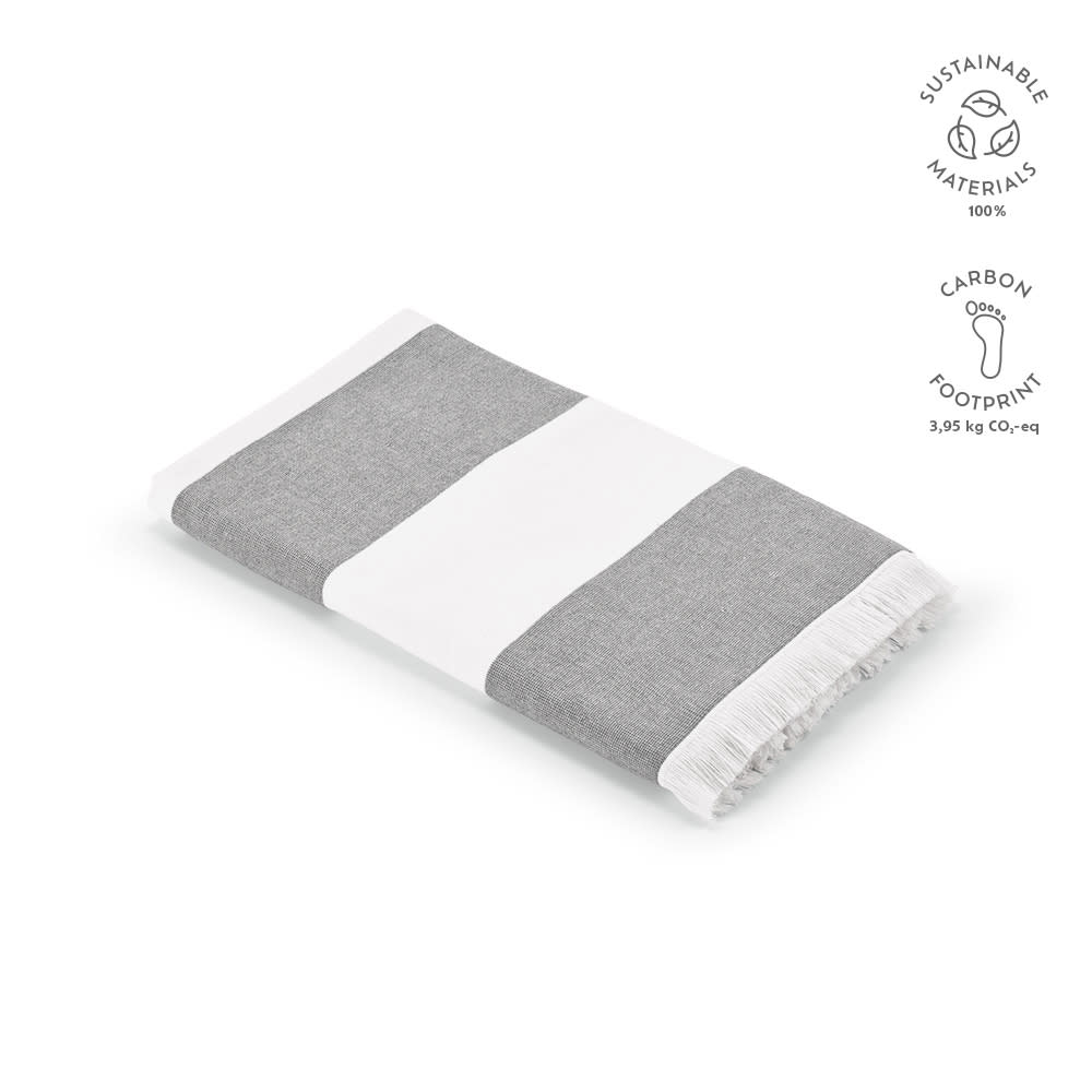 A grey and white striped towel with fringe edges, made of 100% sustainable materials, featuring a logo.