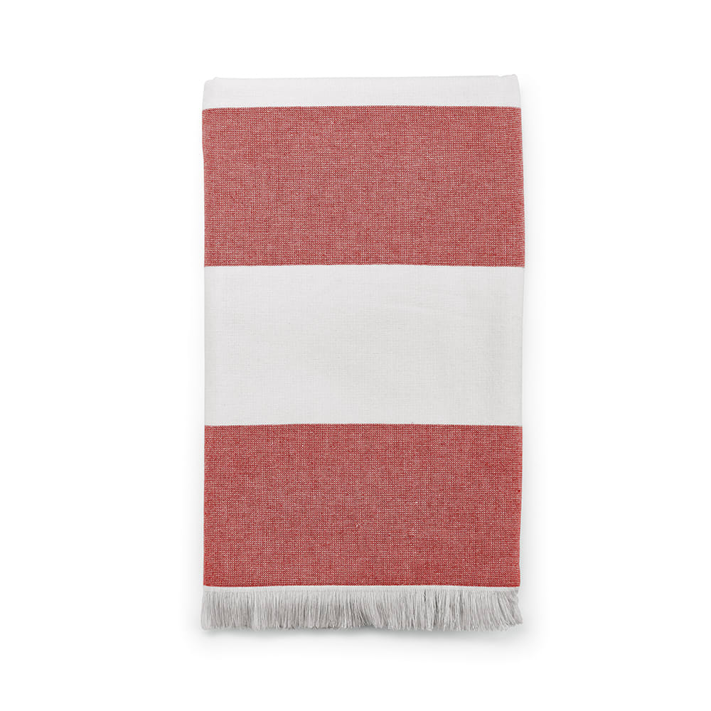 A terracotta and white striped towel with fringe, made from cotton and featuring a logo.