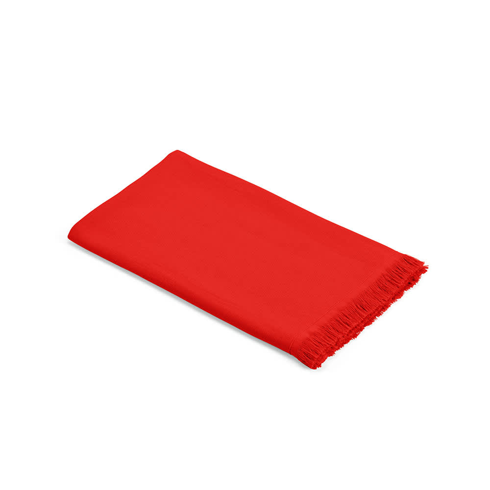 A red towel with fringed edges, made from cotton and featuring a logo.