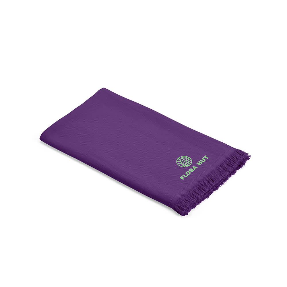 A purple towel with fringing, featuring a logo. Made in Portugal, with a GSM of 250.