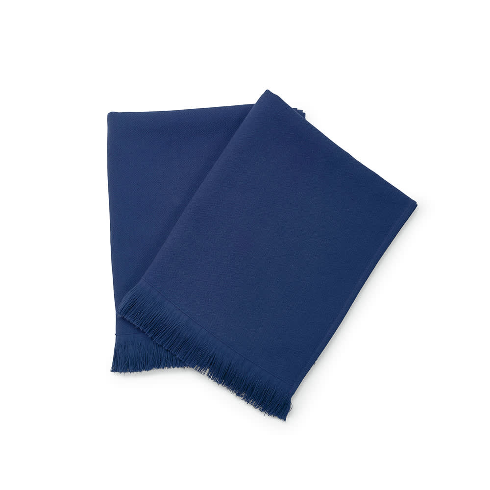 A navy blue towel made from 100% cotton, featuring a fringed edge. The product has a branding logo.