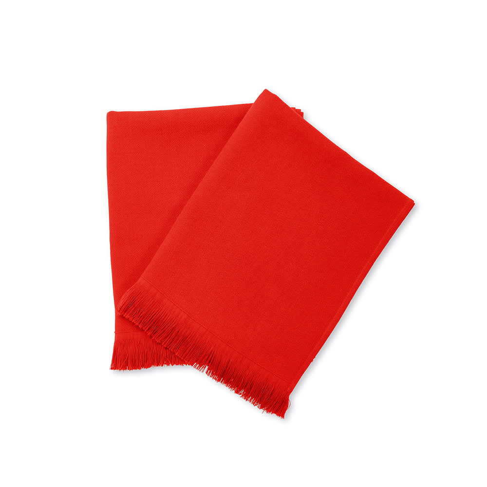A vibrant red cotton towel with a fringed edge, showcasing a soft texture and rich colour. It has branding present.