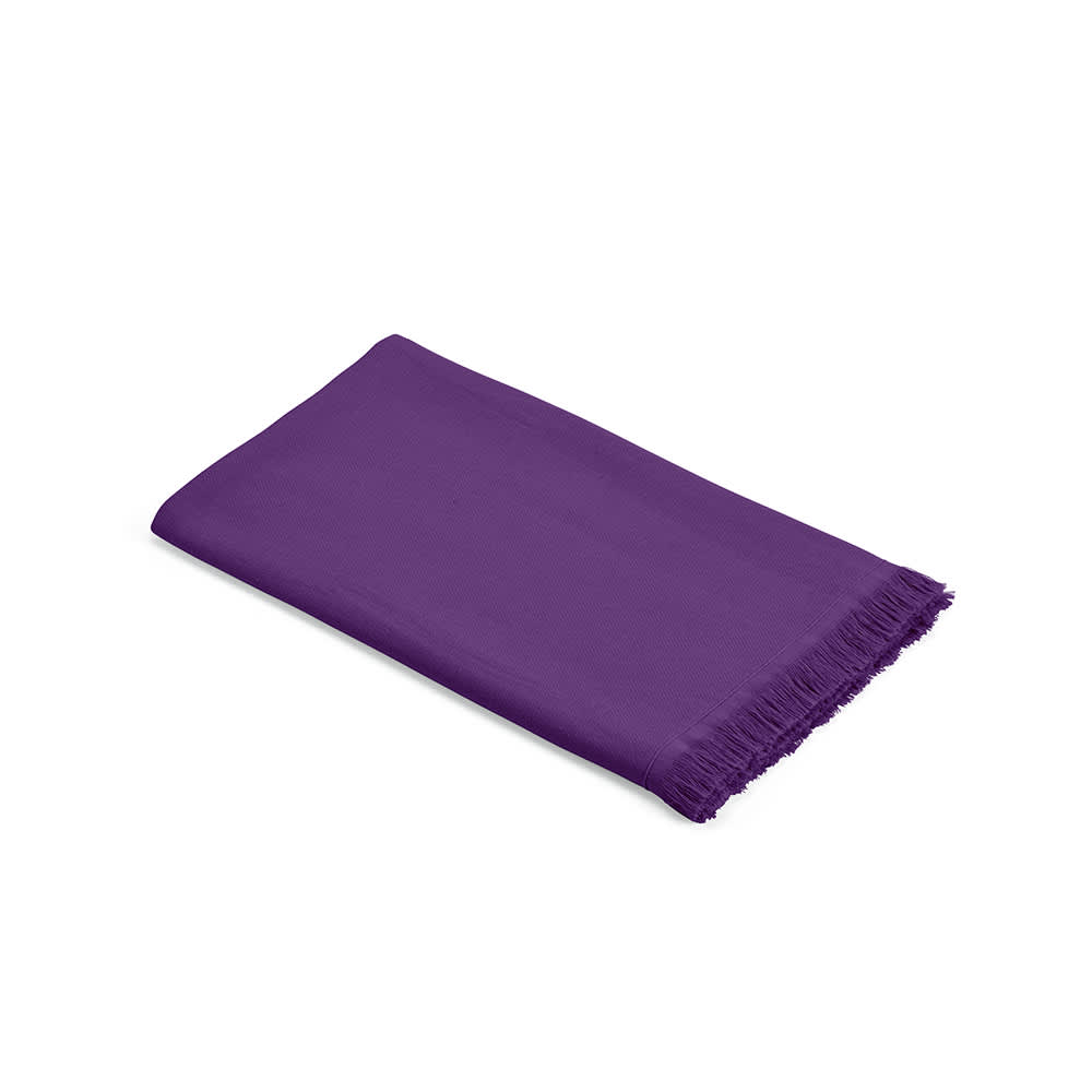 A purple towel with a fringed border, made of 250 gsm cotton and produced in Portugal. Branding present.