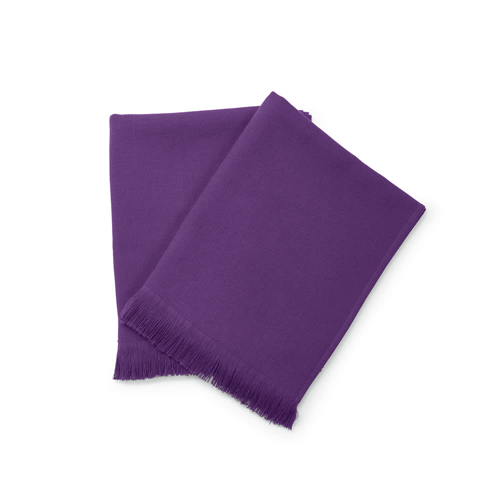 A purple towel made from cotton, featuring a fringed edge. The product is made in Portugal and includes branding.