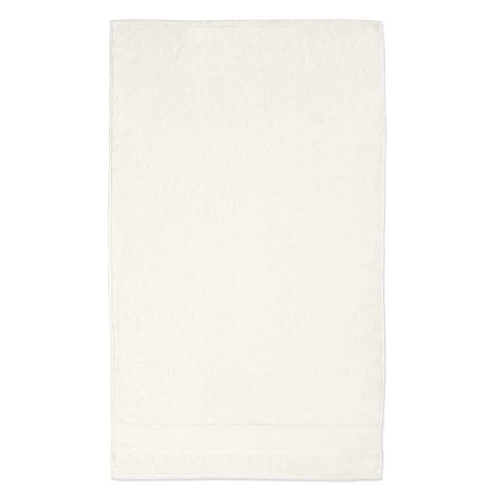 A large, white towel made of cotton with a soft texture, featuring a branding logo.