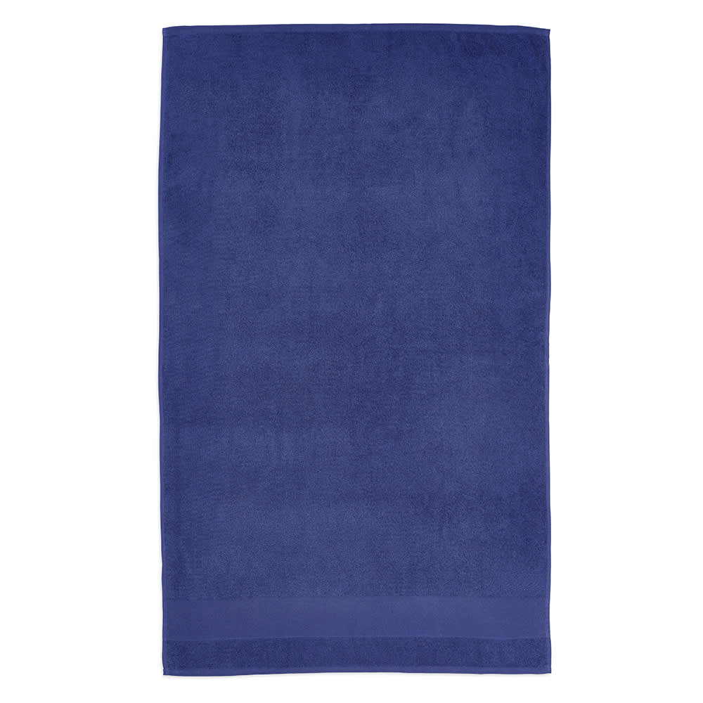 A navy blue towel made of cotton, featuring a soft texture and branding.
