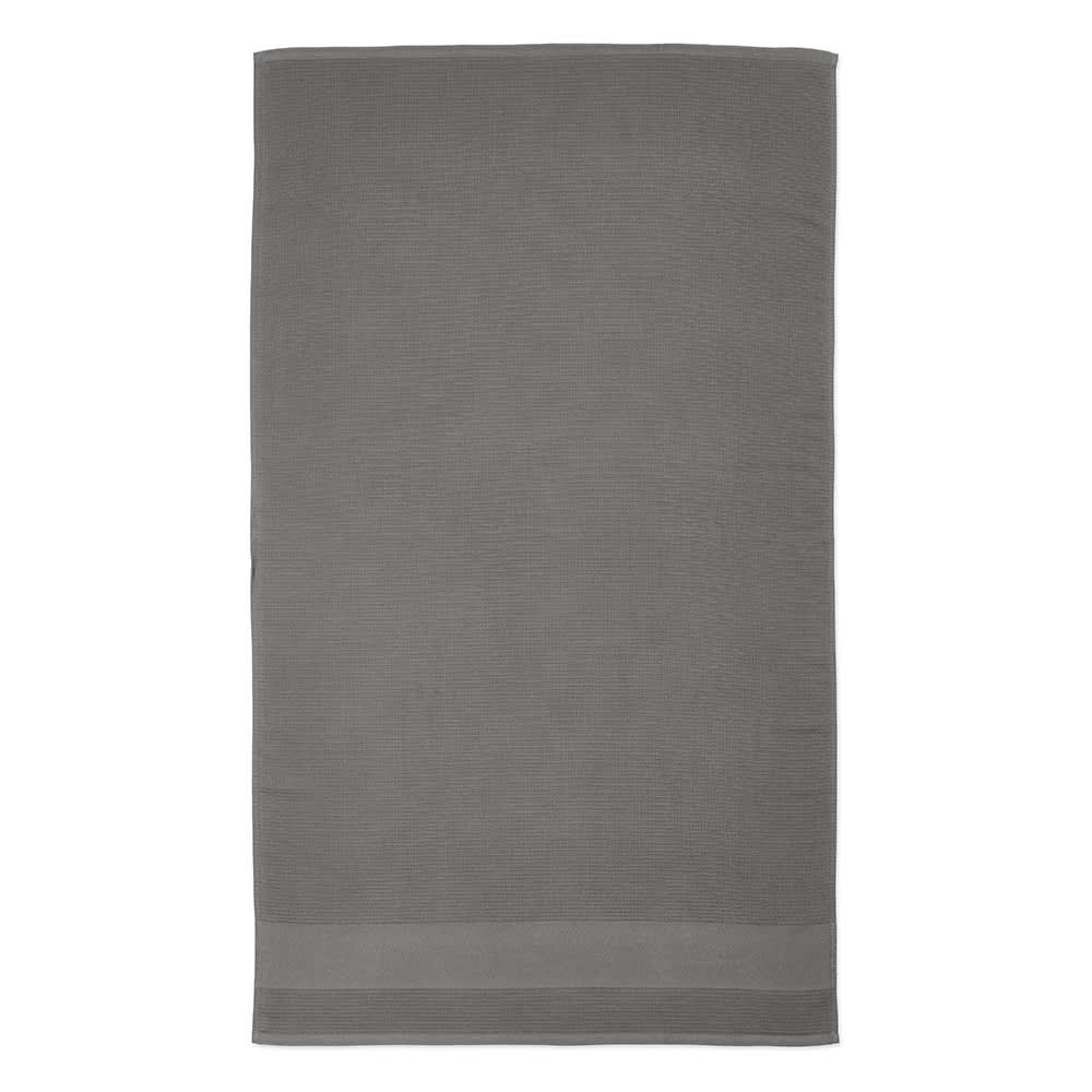 A grey towel made from recycled cotton, featuring a textured design and a logo.