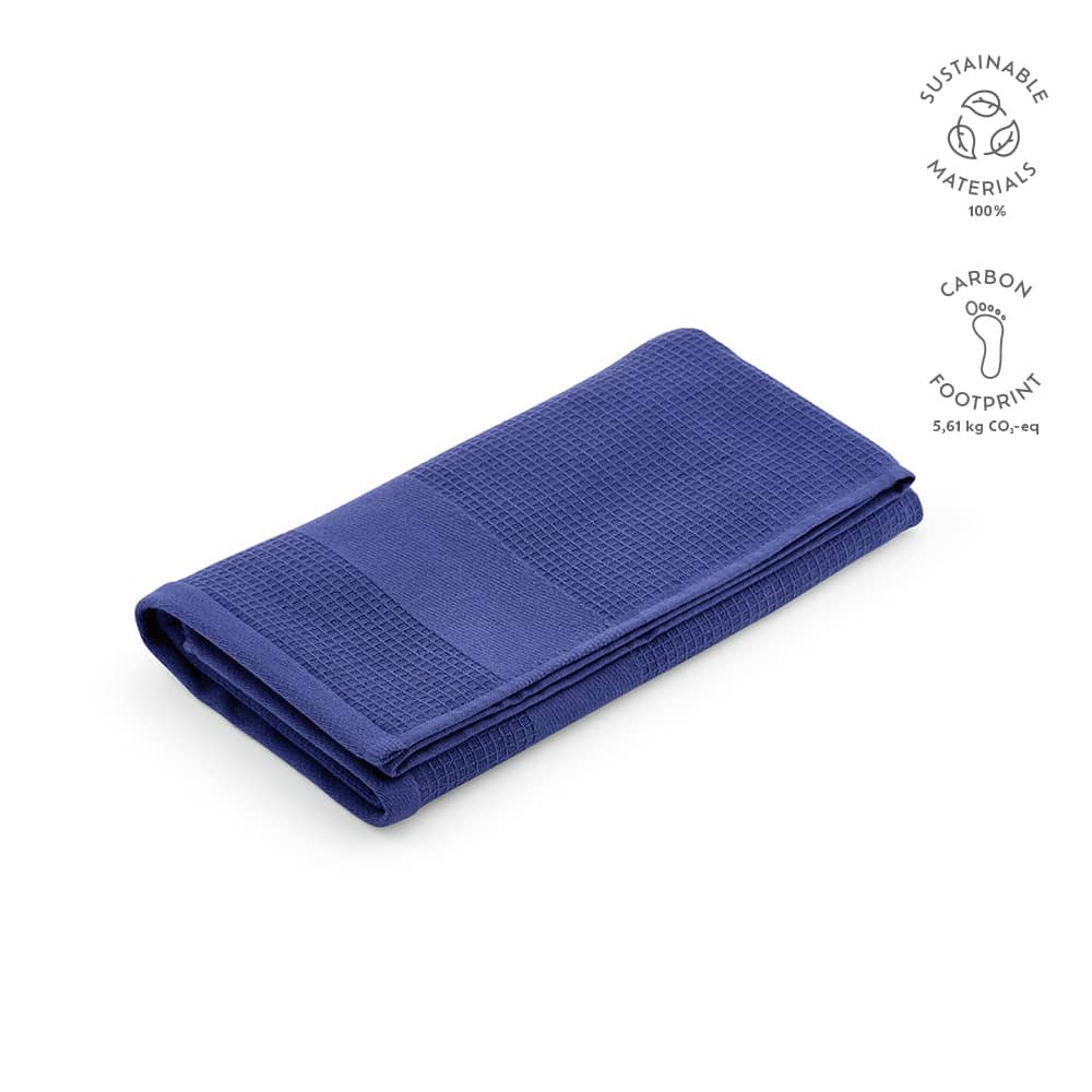 A folded navy blue towel made from 100% recycled cotton, featuring a textured surface and a logo.