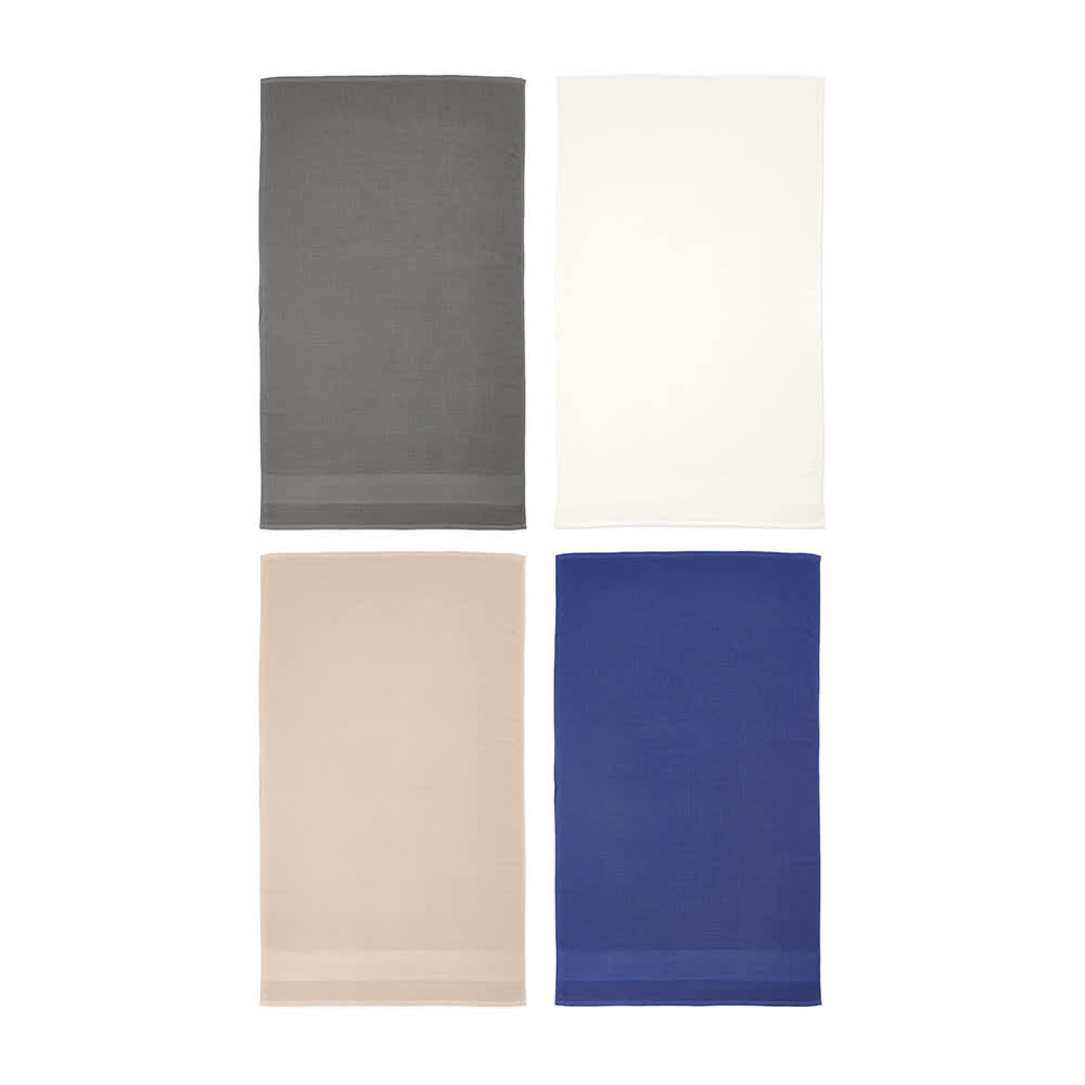 Four towels in grey, cream, beige, and navy colours, featuring a subtle striped design and a logo.