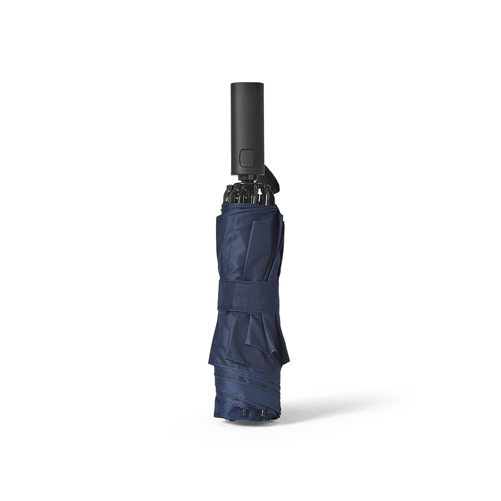 A navy foldable umbrella with a reversible closing mechanism and a black handle. It is secured with a strap.