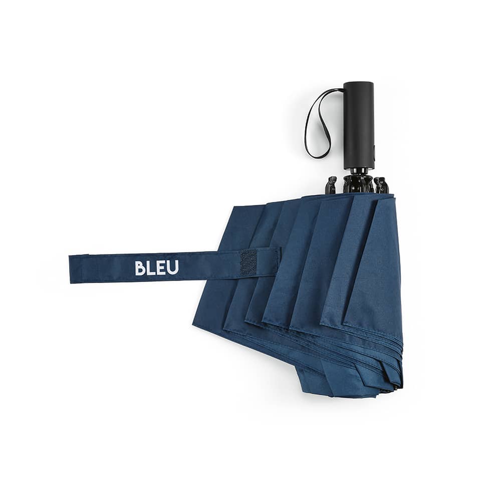 A navy blue foldable umbrella with a reversible closing mechanism and a handle featuring a logo.