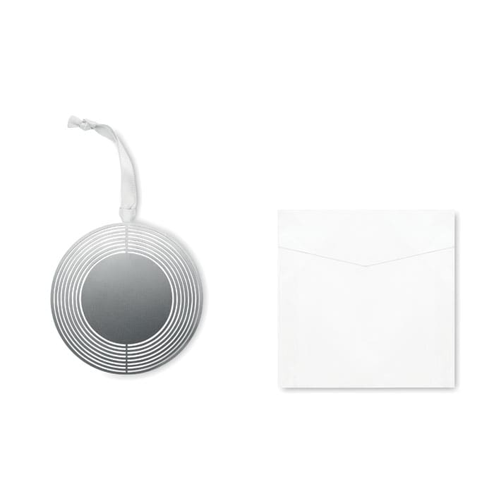 A circular silver decoration with a striped design and a white envelope. The decoration has a ribbon for hanging.