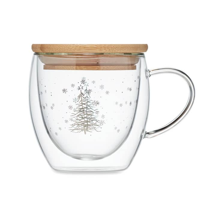 A glass mug with a clear design featuring a silver Christmas tree and snowflakes, topped with a wooden lid.