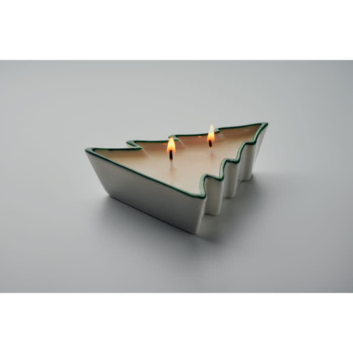 A decorative candle in the shape of a Christmas tree, featuring two wicks and a green trim.