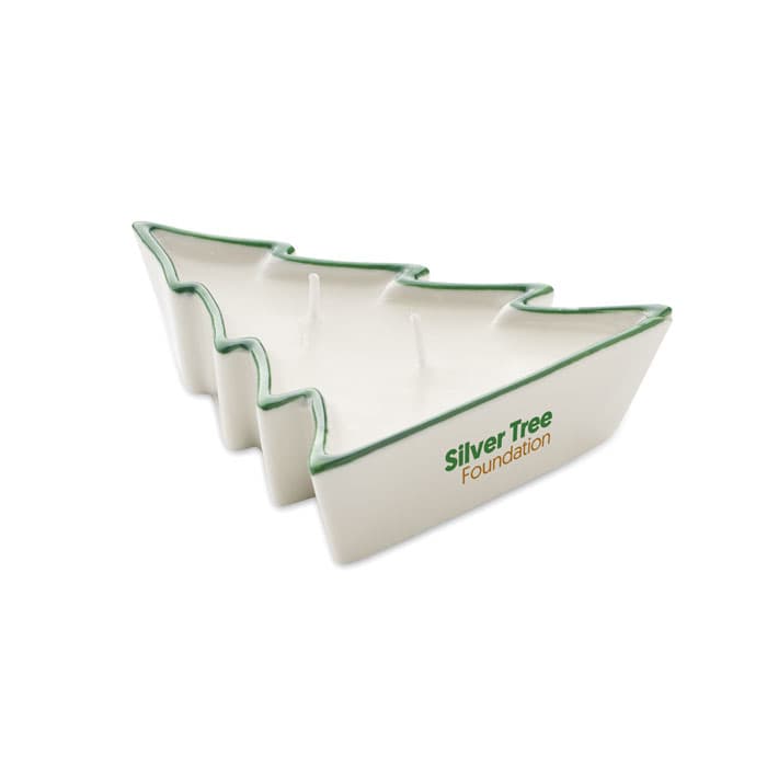 A ceramic tray shaped like a Christmas tree with green edges and a logo.