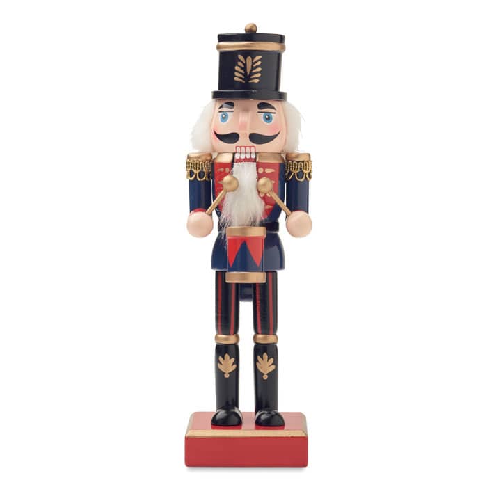 A nutcracker soldier figure with a blue and red uniform, gold detailing, and a white beard, standing on a wooden base.