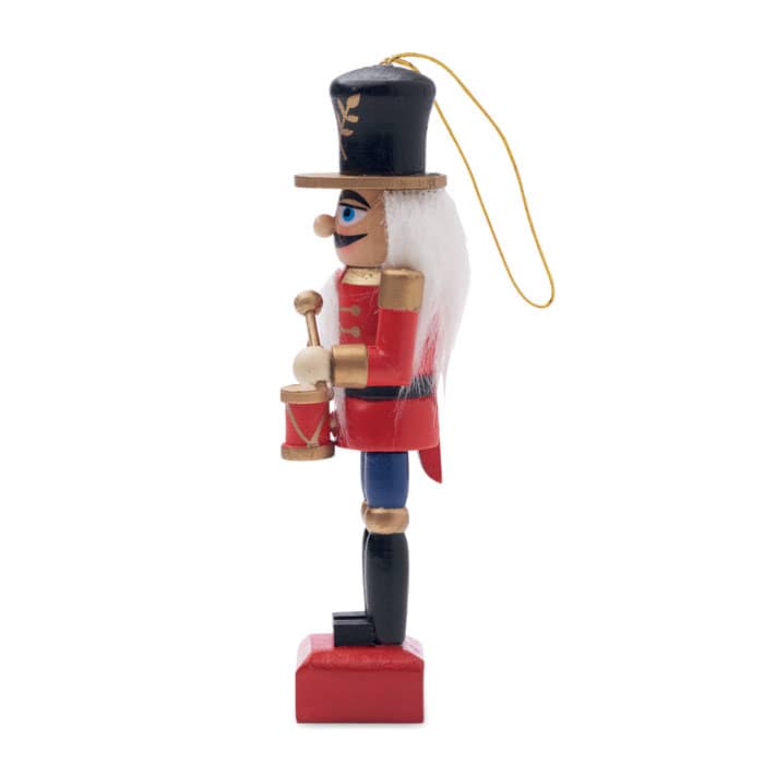 A nutcracker figure in red and black, featuring a drummer with a tall hat and white hair, hanging ornament style.