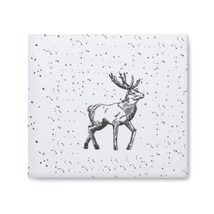 A ceramic tile featuring a black and white illustration of a walking deer on a speckled white background.