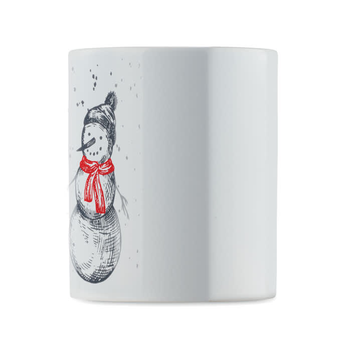 A white ceramic mug featuring a snowman design, complete with a red scarf and a knitted hat.