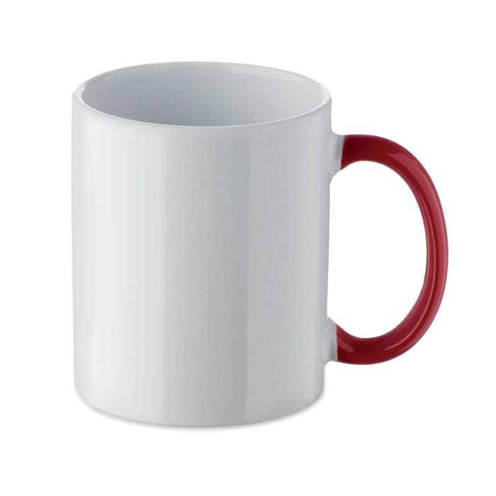 A white mug with a red handle and a glossy finish, featuring a smooth surface and no visible branding.