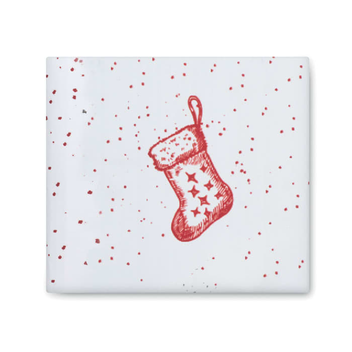 A festive wrapping paper featuring red polka dots and a red Christmas stocking design against a white background.