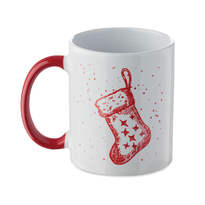 A red and white mug featuring a festive Christmas stocking design with small snowflakes. It has a red handle.